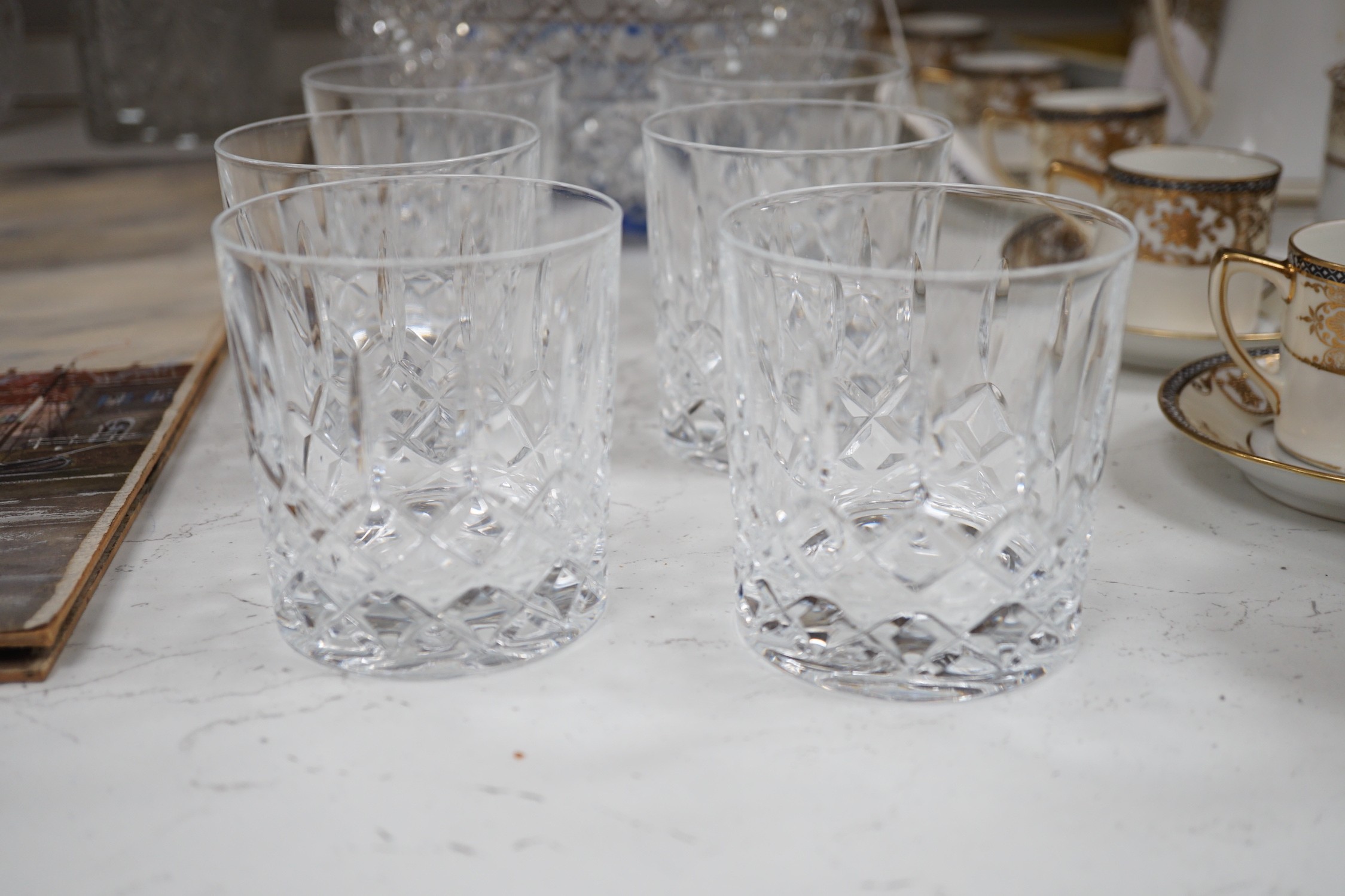 A Pair of Bohemian or Czech heavy cuts glass fruit bowls with blue flashed centres, 22.5 cm diameter, two decanters and six tumblers.